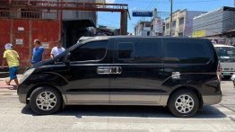 Black Hyundai Grand Starex 2011 at 85000 km for sale 