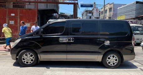 Black Hyundai Grand Starex 2011 at 85000 km for sale 