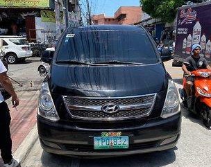 Black Hyundai Grand Starex 2011 at 85000 km for sale 