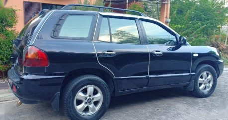 Black Hyundai Santa Fe 2014 for sale in Davao 